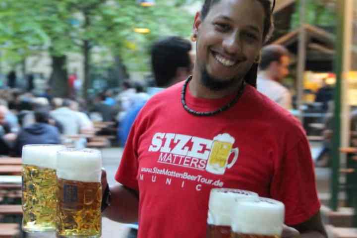 a person holding a beer