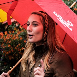 a person holding a colorful umbrella