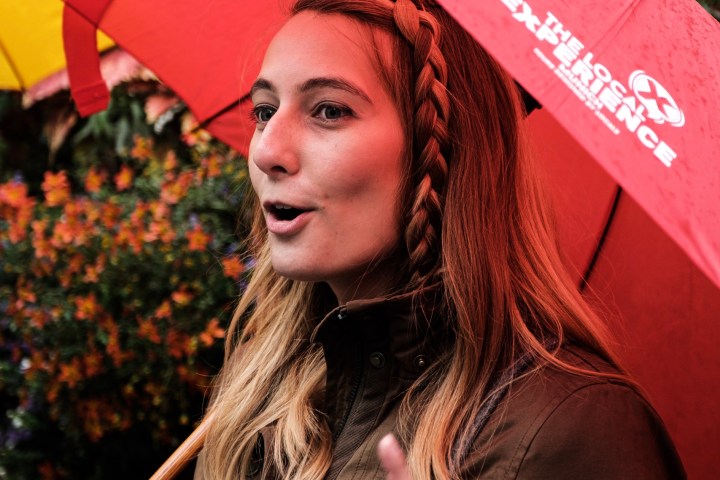 a person holding a colorful umbrella
