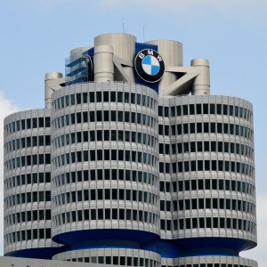 BMW headquarters building with circular towers and logo on top.