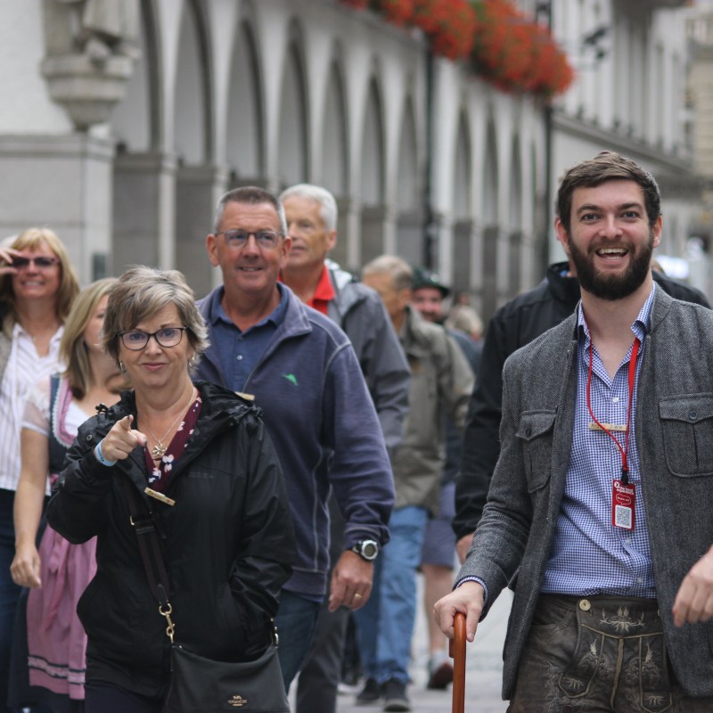 tour guide with walking tour in munich during oktoberfest