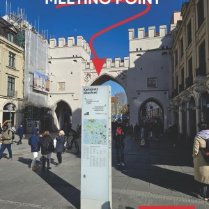 A city gate with people walking, labeled 'Walking Tour Meeting Point,' time '10:15 AM.'