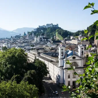 View across the Salzach River towards Salzburg Old Town and Hohensalzburg Fortress