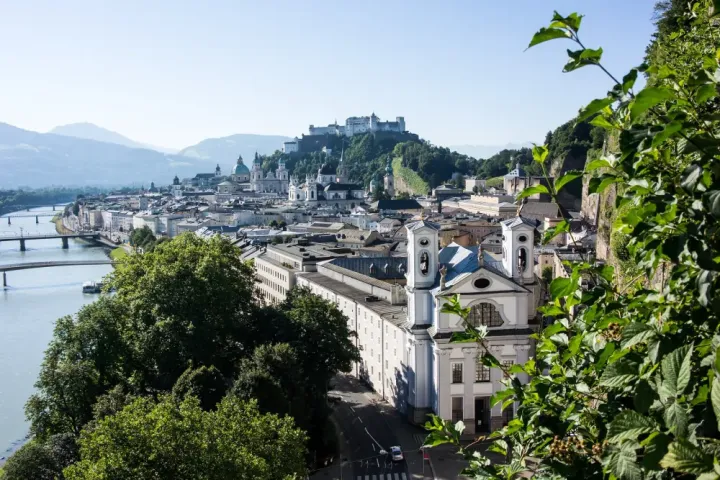 View across the Salzach River towards Salzburg Old Town and Hohensalzburg Fortress