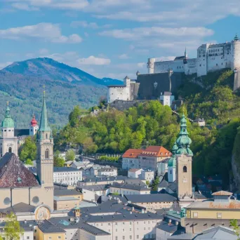 Scenic view of Salzburg with Hohensalzburg Fortress and churches.