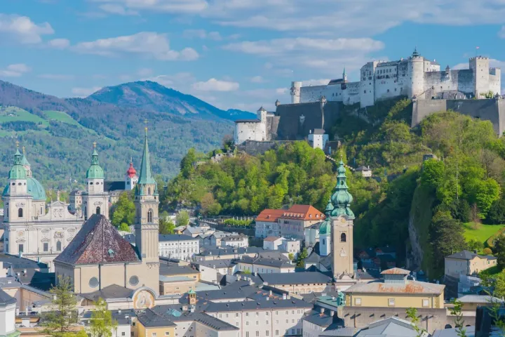 Scenic view of Salzburg with Hohensalzburg Fortress and churches.